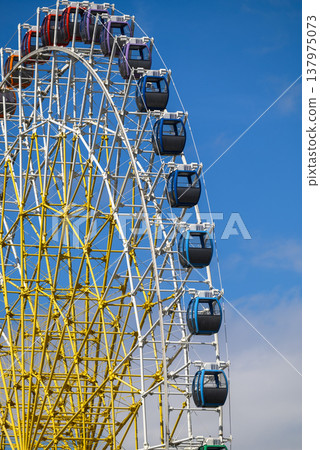 Ferris wheel detail with gondola cabins on blue sky Ferris wheel detail with gondola cabins on blue sky 137975073