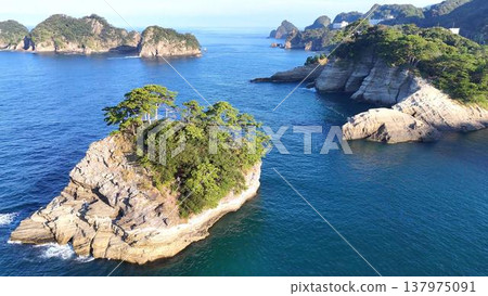 The white rocky island of Dogashima. A beautiful seascape with layers of tuff (aerial view, West Izu). 137975091