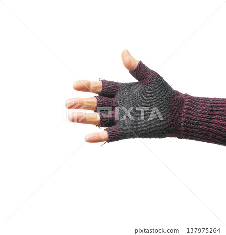 a male hand with a fingerless woolen glove a male hand with a fingerless woolen glove 137975264