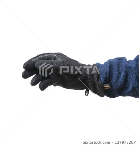 a male hand with a fingerless woolen glove a male hand with a fingerless woolen glove 137975267