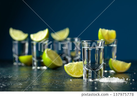 Tequila shots with lime slices and sea salt. 137975778
