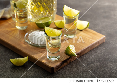 Tequila with sea salt and lime slices. 137975782