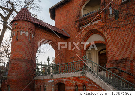 Historic Red Brick Archway with Staircase and Tower 137975862
