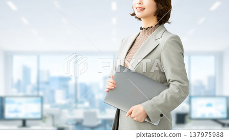 Smiling woman/businesswoman with a laptop 137975988
