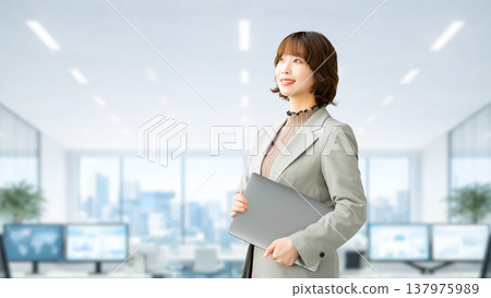 Smiling woman/businesswoman with a laptop 137975989