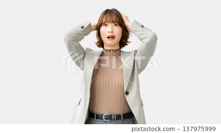 A woman/businesswoman holding her head in trouble A woman/businesswoman holding her head in trouble 137975999