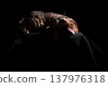 Bengal cat on a black background. A low key, the outline of an animal. 137976318