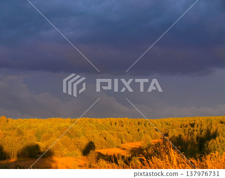 Thunderstorm over the forest. Autumn. Dramatic nature. Thunderstorm over the forest. Autumn. Dramatic nature. 137976731