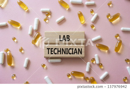 LAB TECHNICIAN symbol. Concept word LAB TECHNICIAN on wooden blocks. Beautiful pink background with pills. Medicine and LAB TECHNICIAN. Copy space LAB TECHNICIAN symbol. Concept word LAB TECHNICIAN on wooden blocks. Beautiful pink background with pills. Medicine and LAB TECHNICIAN. Copy space 137976942