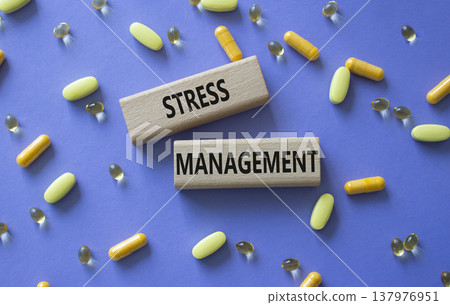 STRESS MANAGEMENT symbol. Concept word STRESS MANAGEMENT on wooden blocks. Beautiful purple background with pills. Medicine and STRESS MANAGEMENT. Copy space STRESS MANAGEMENT symbol. Concept word STRESS MANAGEMENT on wooden blocks. Beautiful purple background with pills. Medicine and STRESS MANAGEMENT. Copy space 137976951