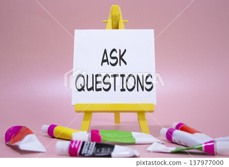 Ask Questions symbol. Wooden blocks with words Ask Questions. Beautiful pink background with paints and easel. Business and Ask Questions concept. Copy space. Ask Questions symbol. Wooden blocks with words Ask Questions. Beautiful pink background with paints and easel. Business and Ask Questions concept. Copy space. 137977000