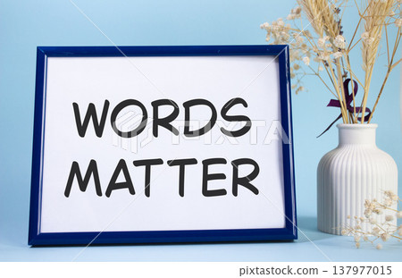 Words Matter symbol. Concept words Words Matter on beautiful wooden picture frame. Beautiful light blue background with flower vase. Business and Words Matter concept. Copy space. Words Matter symbol. Concept words Words Matter on beautiful wooden picture frame. Beautiful light blue background with flower vase. Business and Words Matter concept. Copy space. 137977015