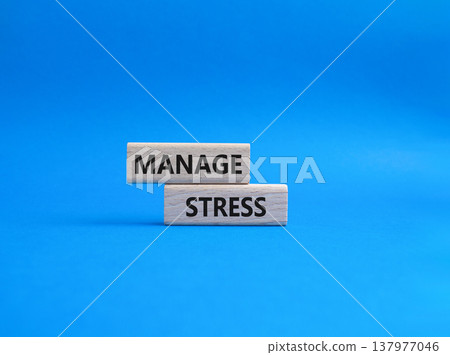 Manage stress symbol. Concept word Manage stress on wooden blocks. Beautiful blue background. Business and Manage stress concept. Copy space Manage stress symbol. Concept word Manage stress on wooden blocks. Beautiful blue background. Business and Manage stress concept. Copy space 137977046