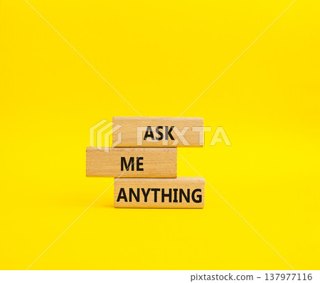 Question symbol. Concept words Ask me Anything on wooden blocks. Beautiful yellow background. Business and Ask me Anything concept. Copy space Question symbol. Concept words Ask me Anything on wooden blocks. Beautiful yellow background. Business and Ask me Anything concept. Copy space 137977116