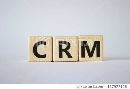 CRM - Customer relationship management symbol. Concept word CRM on wooden cubes. Beautiful white background. Business and CRM concept. Copy space. CRM - Customer relationship management symbol. Concept word CRM on wooden cubes. Beautiful white background. Business and CRM concept. Copy space. 137977128