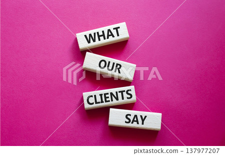 Clients symbol. Concept words What our Clients Say on wooden blocks. Beautiful bright red background. Business and What our Clients Say concept. Copy space. 137977207