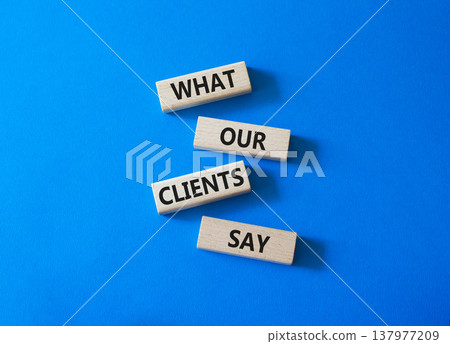 Clients symbol. Concept words What our Clients Say on wooden blocks. Beautiful bright blue background. Business and What our Clients Say concept. Copy space. 137977209