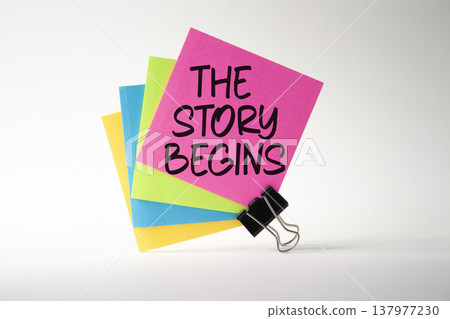 The Story Begins symbol. Sticky notes with words The Story Begins. Beautiful white background. Business and The Story Begins concept. Copy space. The Story Begins symbol. Sticky notes with words The Story Begins. Beautiful white background. Business and The Story Begins concept. Copy space. 137977230