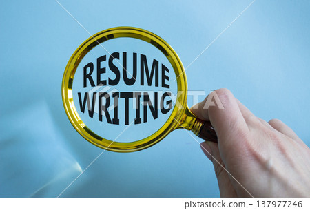 Resume Writing symbol. Magnifying Glass with words Resume Writing. Businessman hand. Beautiful blue background. Business and Resume Writing concept. Copy space. Resume Writing symbol. Magnifying Glass with words Resume Writing. Businessman hand. Beautiful blue background. Business and Resume Writing concept. Copy space. 137977246