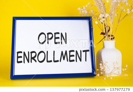Open Enrollment symbol. Concept words Open Enrollment on beautiful wooden picture frame. Beautiful yellow background with flower vase. Business and Open Enrollment concept. Copy space. Open Enrollment symbol. Concept words Open Enrollment on beautiful wooden picture frame. Beautiful yellow background with flower vase. Business and Open Enrollment concept. Copy space. 137977279
