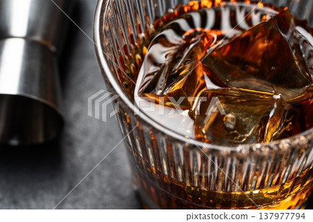 Whiskey with ice in crystal glass 137977794