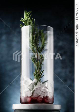 Vertical herbal cocktail with rosemary ice Vertical herbal cocktail with rosemary ice 137977796