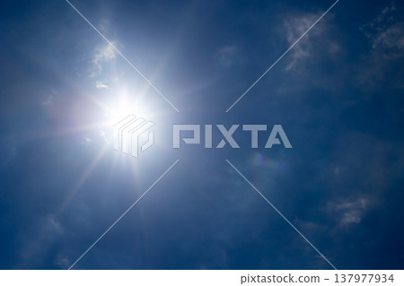 A clear blue sky and sun 137977934