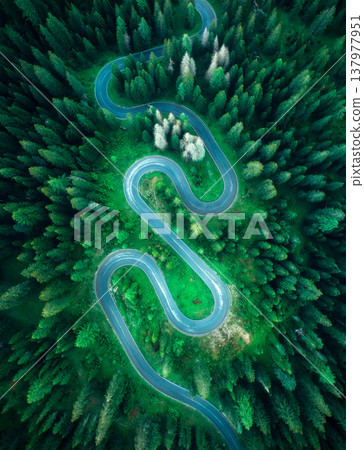 Aerial view of mountain snake road and green forest in summer 137977951