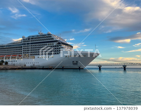 A cruise ship anchored on a Bahamian beach on a summer sunset. Banner for tourism and travel promotion 137978039