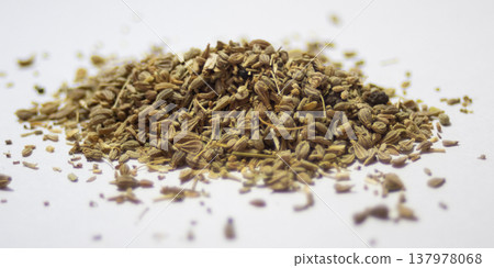 A pile of anise seeds with a white background. 137978068