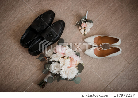 wedding shoes and rings, bridal bouquet on the wooden floor wedding shoes and rings, bridal bouquet on the wooden floor 137978237