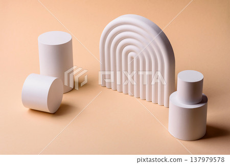 A beige background with a white podium for copy space items or cosmetics. A beige background A beige background with a white podium for copy space items or cosmetics. A beige background 137979578