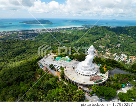 Aerial View drone shot of Big Buddha Statue on the high mountain at Phuket thailand Aerial View drone shot of Big Buddha Statue on the high mountain at Phuket thailand 137980297