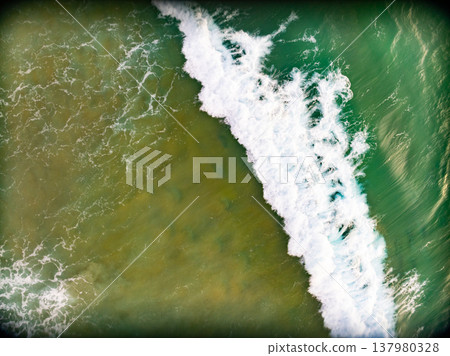 Top view waves crashing on beach background Top view waves crashing on beach background 137980328