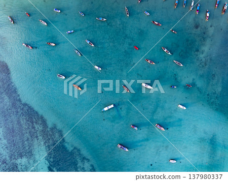 Aerial drone bird's eye view photo Top down of tropical sea with long tail fishing boats at phuket thailand 137980337