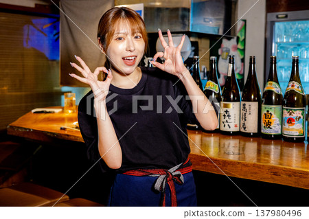 Woman working at a bar Woman working at a bar 137980496