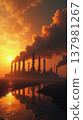 Smoking chimneys of oil refinery emitting black smoke into atmosphere reflecting in water at sunset with dramatic lighting. 137981267