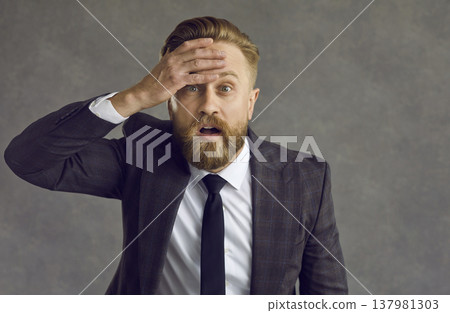 Portrait of a shocked businessman who is affected by the coronavirus crisis and financial losses. 137981303
