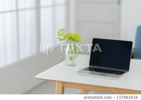A laptop computer placed at the desk 137981638