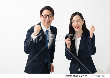 Business person who makes a guts pose 137981822