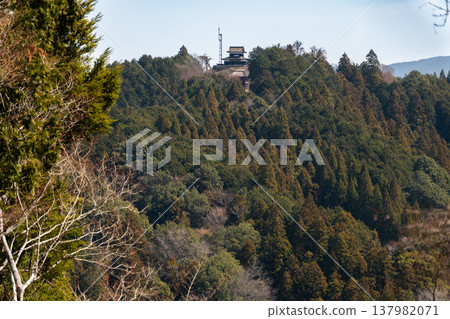 A view overlooking the ruins of Asuke Castle and the surrounding mountain range. A view overlooking the ruins of Asuke Castle and the surrounding mountain range. 137982071