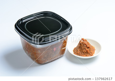 Country-style miso souvenir image: Miso in a container and presentation; homemade-style miso; simple ingredients of packaged fermented food. Country-style miso souvenir image: Miso in a container and presentation; homemade-style miso; simple ingredients of packaged fermented food. 137982617