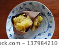 Close-up of a baked sweet potato served on a small plate 137984210