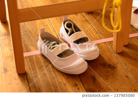 Children's indoor shoes and socks: A typical scene at a nursery school. Children's indoor shoes and socks: A typical scene at a nursery school. 137985080