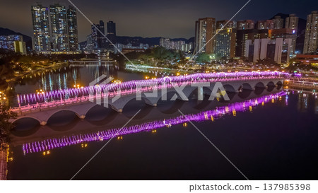 Vibrant Night Lights Illuminate Festive Bridge Over Shing Mun 137985398