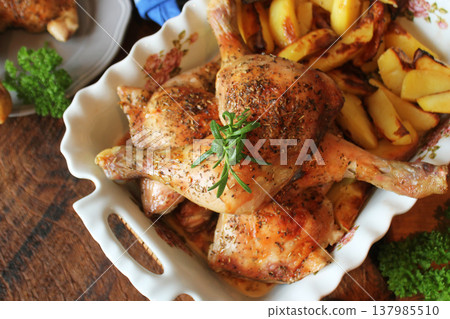 Herb Roasted Chicken Drumsticks with Potato Wedges Herb Roasted Chicken Drumsticks with Potato Wedges 137985510