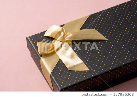 Gift box with a simple ribbon Gift box with a simple ribbon 137986308
