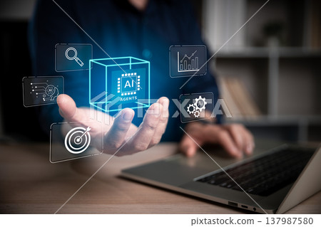 Hand presenting a glowing AI agents cube with search, analytics and automation icons, symbolizing intelligent systems, business tools, machine learning, strategy and digital innovation. 137987580