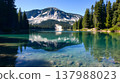 Pristine alpine lake with emerald green water and pine forest reflection 137988023