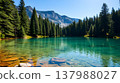 Pristine alpine lake with emerald green water and pine forest reflection 137988027